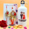 Floret Couple Rakhi with Printed Bottle