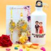 Floret Couple Rakhi with Printed Bottle